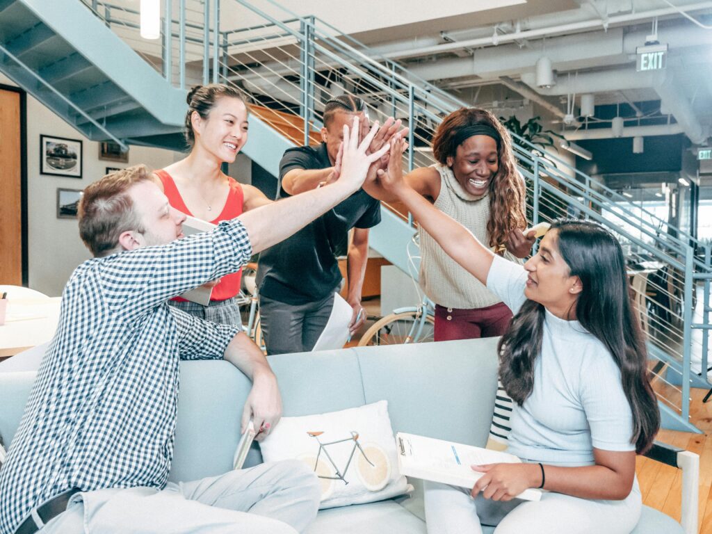 A diverse team looking energetic, motivated, and well-rested in a meeting.
